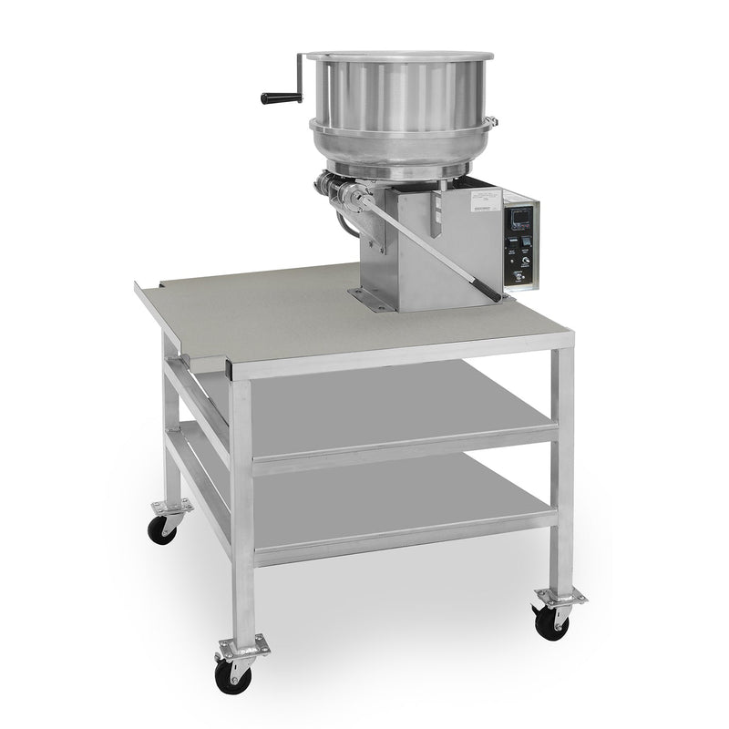 Metal cart on four caster wheels with two shelves. A deep pan is sitting on each shelf. On the top of the cart sits a fudge mixer with tilt handle and lid.