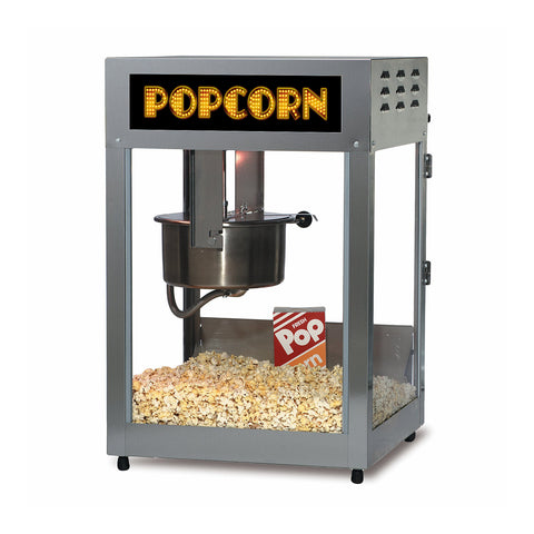 Popcorn Machine with yellow showbiz popcorn text sign isolated on black background.