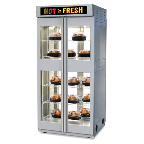 A stainless steel heated commercial display case with two glass doors, filled with roasted chicekn on wire racks. The top has a black sign reading 'HOT 'N FRESH' in red and yellow.
