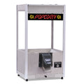 Stainless steel ReadyServe Jr. self-serve popcorn machine with illuminated “Popcorn” sign and front push-and-hold dispensing chute.