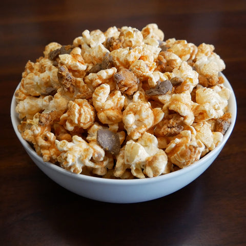 Popcorn in a bowl with butterfinger pieces