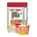 Compact commercial popcorn machine with popped popcorn inside, displayed with Mega Pop popcorn kit, kettle cleaner container, and popcorn serving bag.