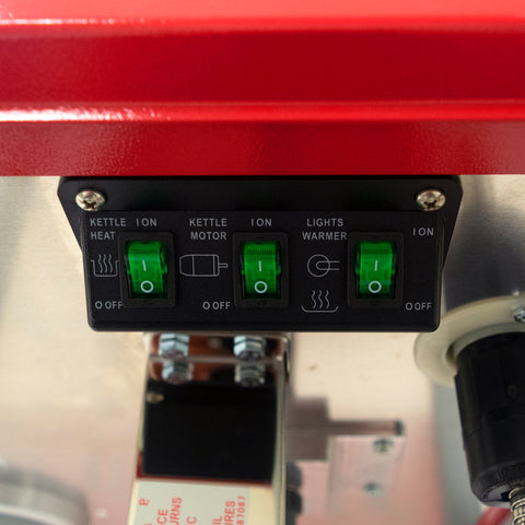 close-up view of controls including kettle heat, kettle motor, and lights warmer switch