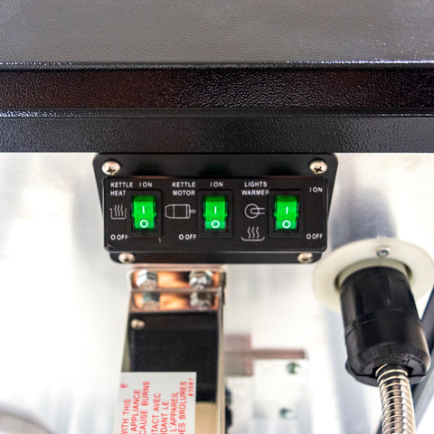 close-up view of controls including kettle heat, kettle motor, and lights warmer switch