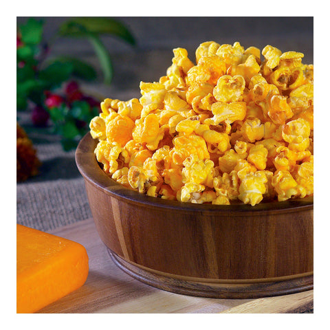 vegan cheddar popcorn shown in wooden bowl