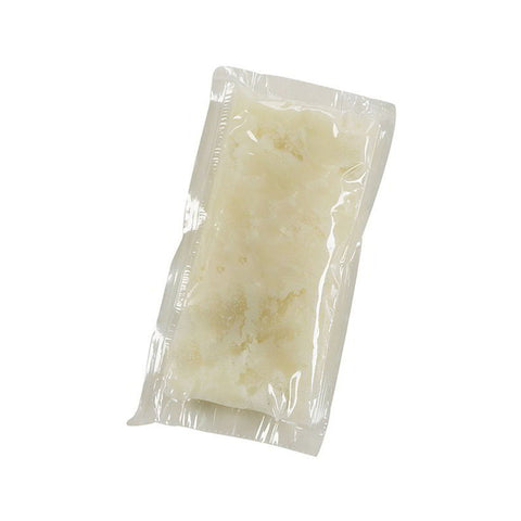 clear pouch of white coconut oil