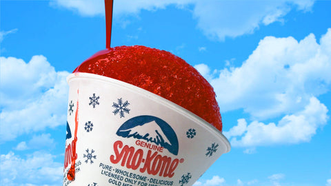 red Sno-Kone syrup being poured over ice