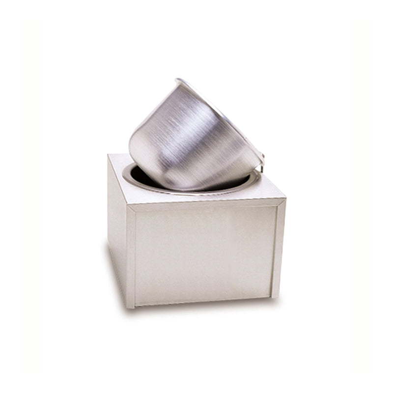 Metal square box with circular opening in the top, and stainless steel sitting tilted to the right in the opening.