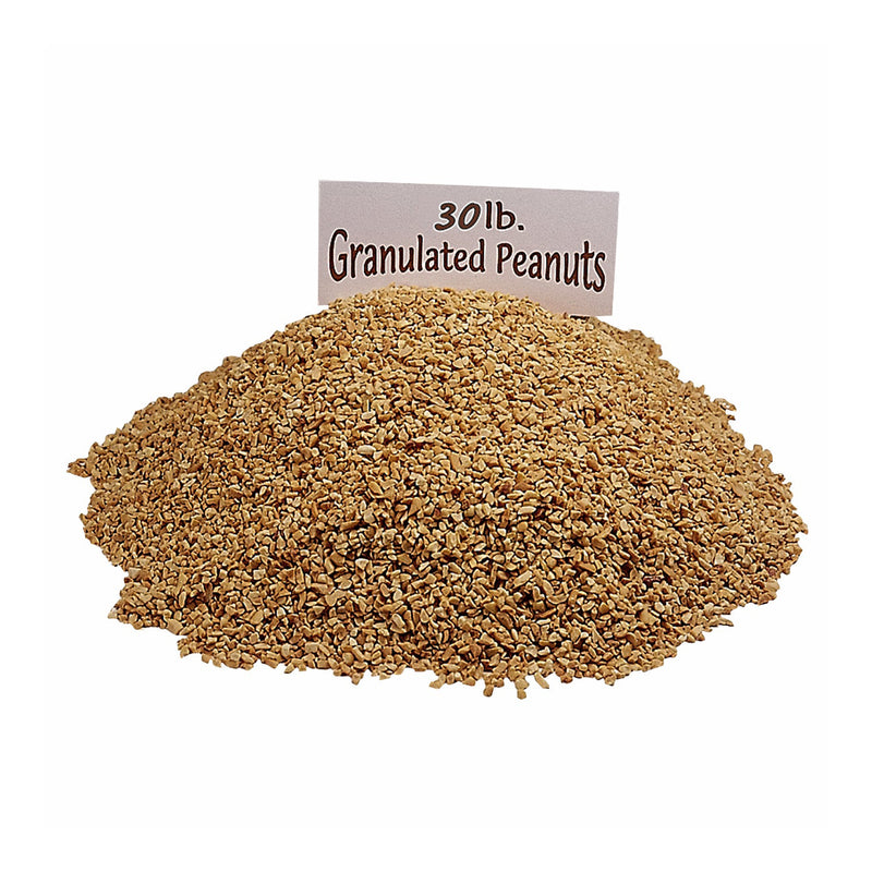 Pile of chopped peanuts with a white and black sign stating 30 pounds granulated peanuts.