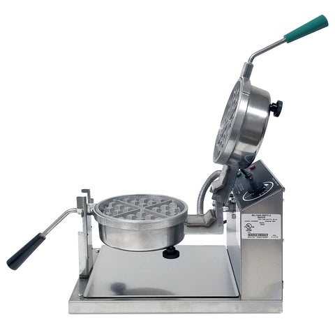 Side view of two, silver, removable round belgian waffle deep square grids, opened, with a black handle on bottom grid and green handle on top grid. Baker is mounted on silver base with dial temperature control panel behind the grids. 