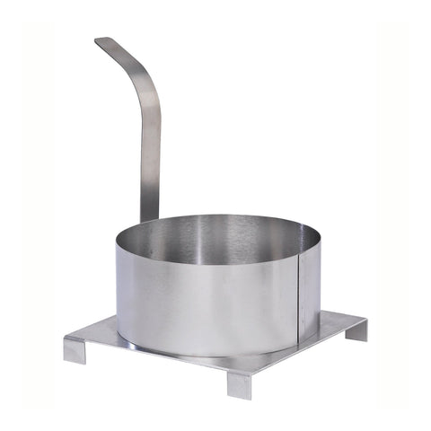 Stainless steel round funnel cake mold with handle sitting on short platform.