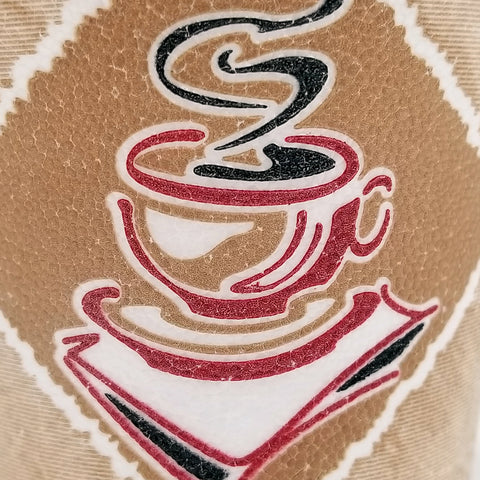 Close up shot of white insulated disposable coffee cup with graphic of coffee cup with steam printed on the side.