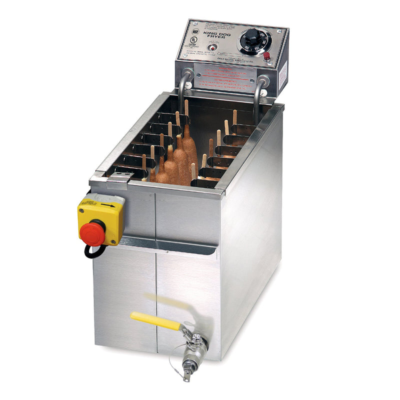Stainless steel fryer, deep narrow rectangle oil tank, right front mounted safety drain with yellow handle, left front mounted emergency stop button. Control panel rear mounted above oil tank. Skewer clips with corn dogs inside tank.